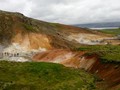 Geothermal springs and vents at Krysuvik. A small group of tourists were there in the cold morning.