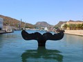 The Escultura Cola de Ballena in the harbor.