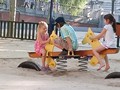 She made a full recovery at the sight of a playground. They played with the local kids with "holas" and meows.