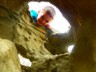The trail was walled with rocks full of holes and tunnels.