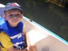 Andrew is relaxing on the paddleboat.