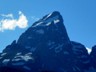 The snow-covered tip of the Tetons stands 13,700 feet above sea level.