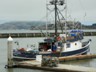 A fishing boat docked in the Golden Gate.