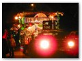 The parade is attended by neighbors who lay out picnics on their lawn and make their own floats.