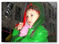 Andrew was not too happy to be wearing his rain jacket and carrying umbrellas.