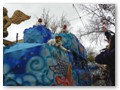 Another iris float unloads on the Nola residents who cordoned off sections of the sidewalk.