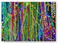 Beads hanging from a treee across the street.