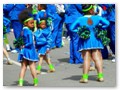 A bunch of marching girls hope that the parade gets moving soon.