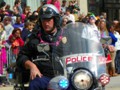 Before the Spanish Town parade took the streets, cops cleared the path of the people playing football, selling wares, or just walking the route.