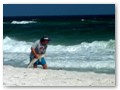 Our beach neighbor caught a shark. Here he is releasing it. We decided to take a swimming break.
